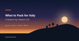 What to pack for Italy cover: coastal cliffs and hillside houses at dusk