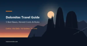 The three towers of the Tre Cime di Lavaredo in silhouette against a dusk sky, from the Dolomites travel guide