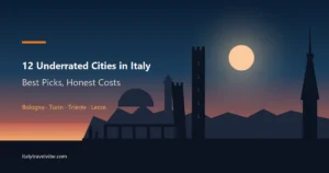 Bologna's two towers and a run of porticoes in silhouette against a dusk sky, with Turin's Mole spire at the right, from the guide to underrated cities in Italy